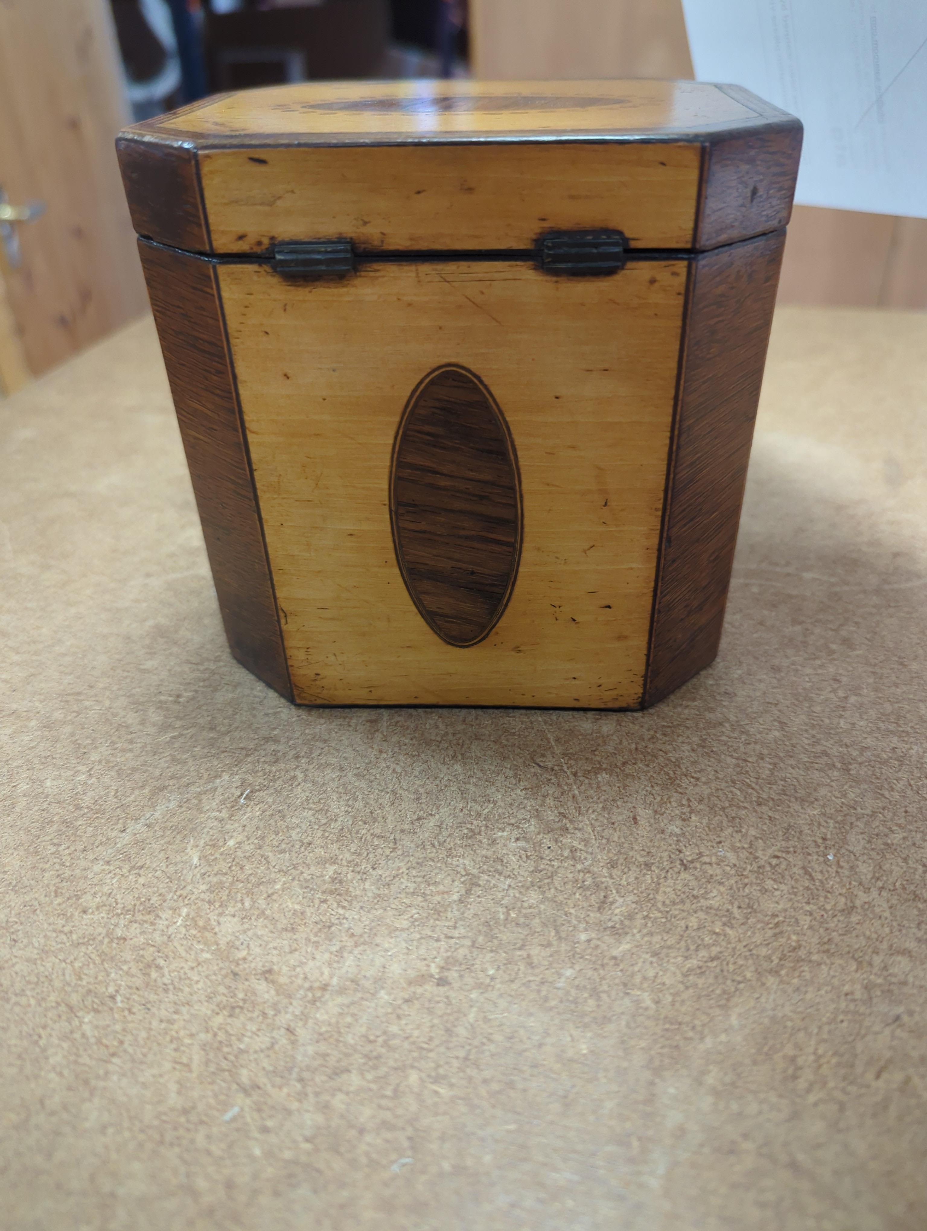 A George III sycamore and rosewood octagonal tea caddy, 13cm